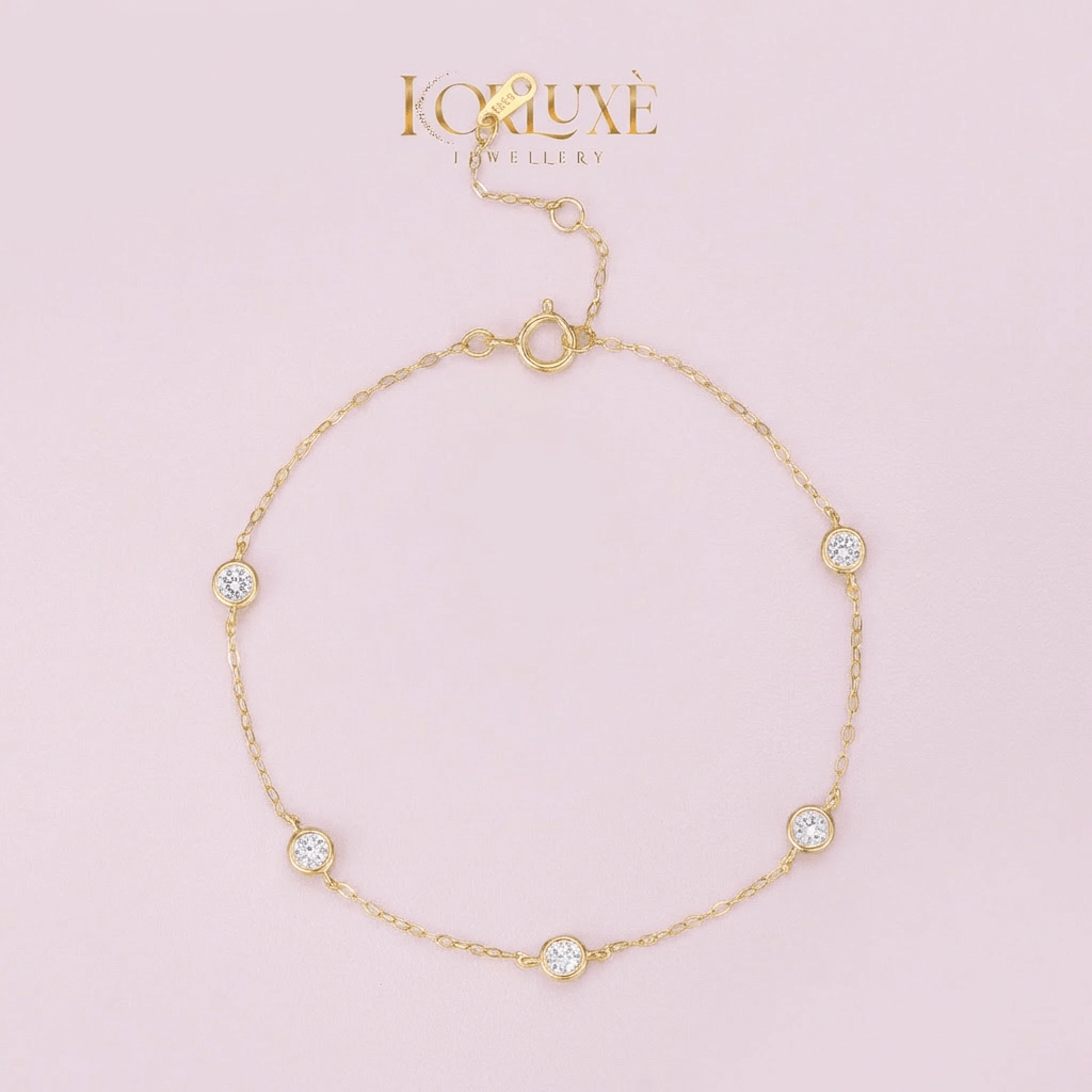 KorLuxé Gold-Plated Crystal Station Bracelet showcasing sparkling crystals on a delicate gold chain.