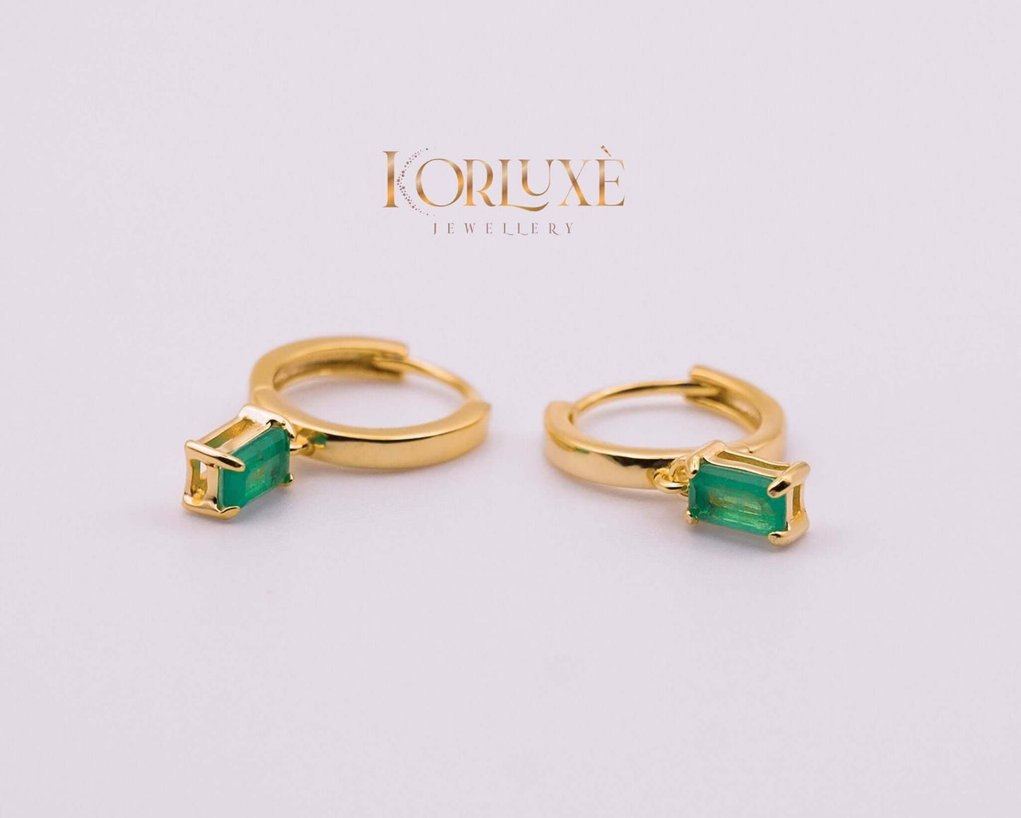 KorLuxé Emerald Cut Drop Hoop Earrings showcasing emerald stone and gold hoop design.