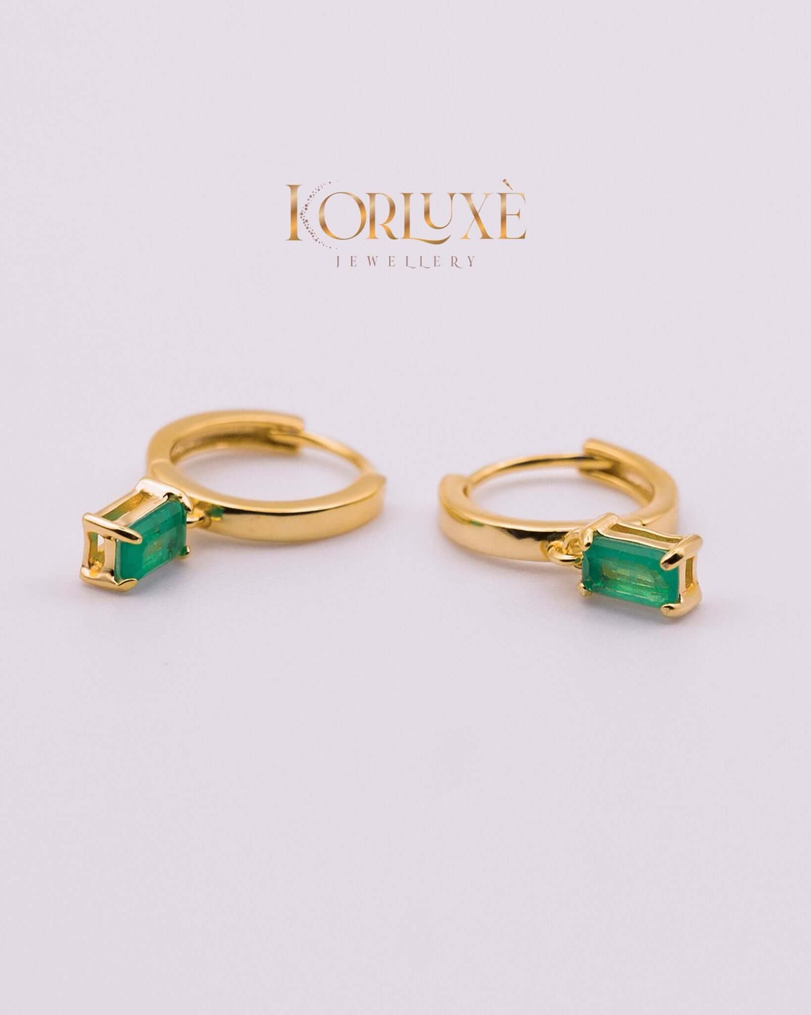 KorLuxé Emerald Cut Drop Hoop Earrings showcasing emerald-cut stones in elegant gold hoops.