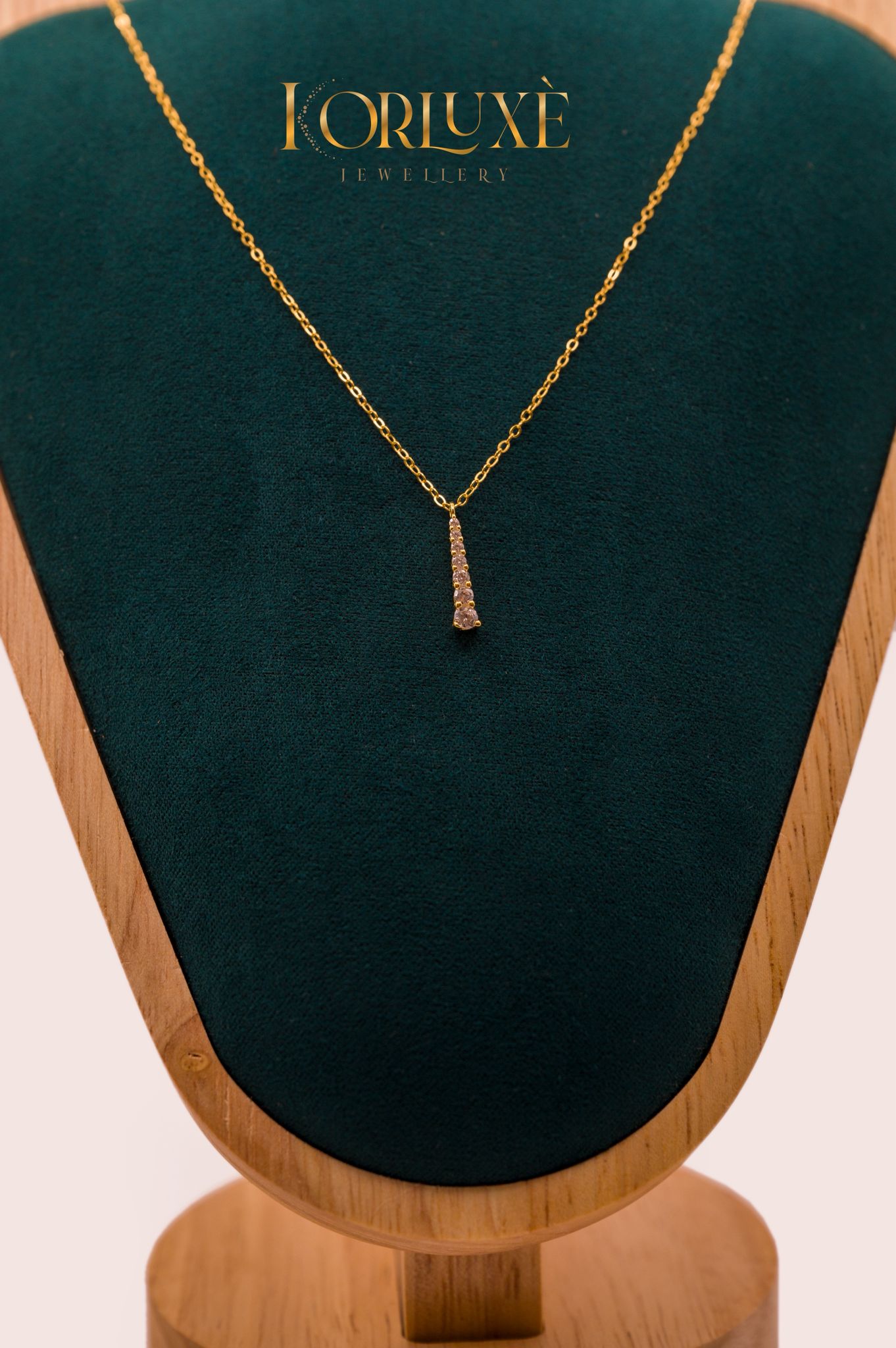 Gold-Plated Crystal Necklace displayed on a velvet stand, showcasing elegance and luxury.