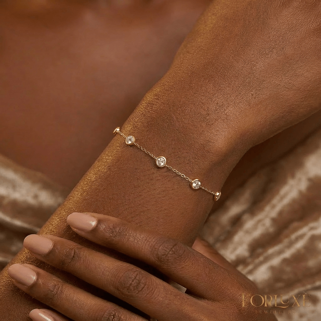 KorLuxé Gold-Plated Crystal Station Bracelet worn on a wrist, showcasing its elegant design and sparkling crystals.